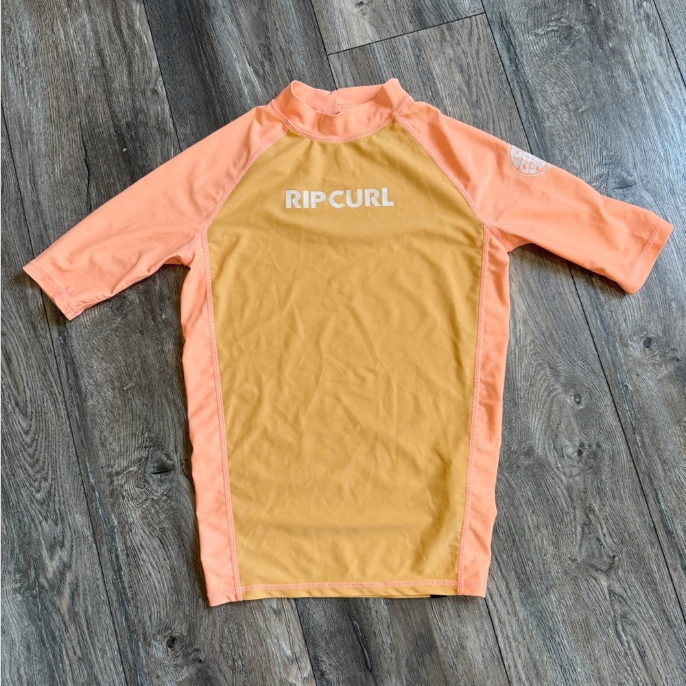 Rip Curl Kids Rash Guard - neon orange size 12. Only worn a couple times
